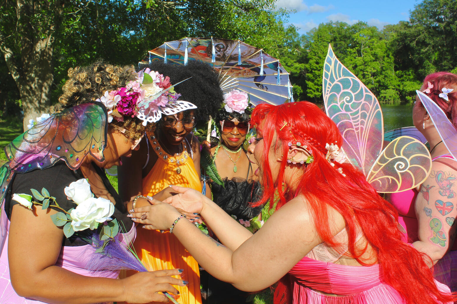 Strawberry fae in conversation sharing a treasure with fae friends