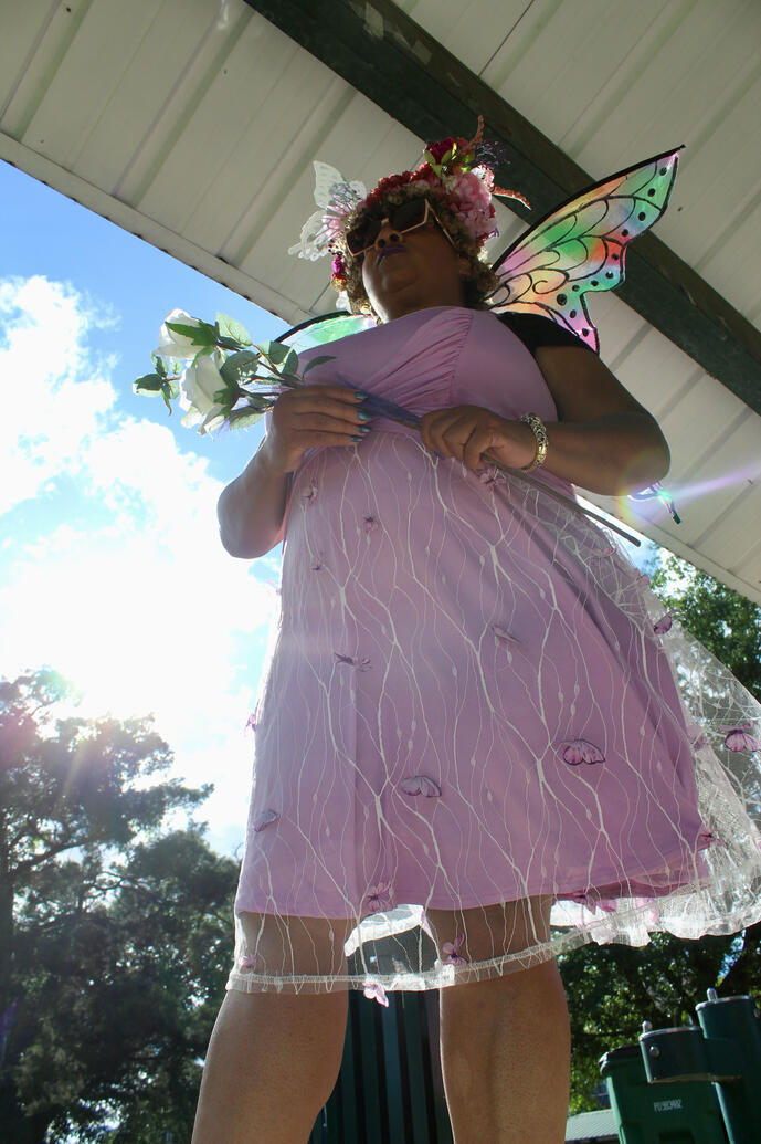 from the bottom up fierce fairy looking towards the sky with authority.